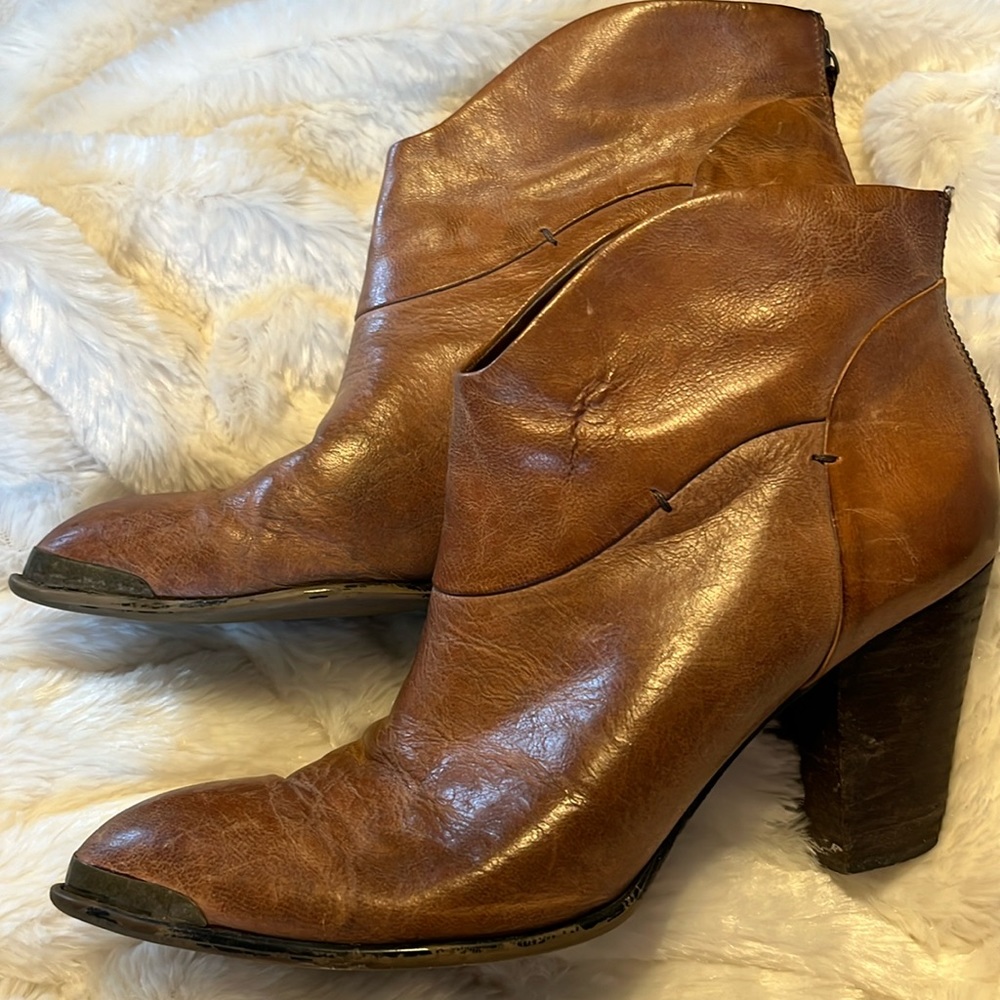 Brown leather ankle bootie.